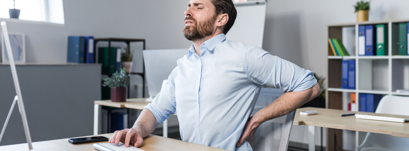 Office worker experiencing persistent spine pain while sitting